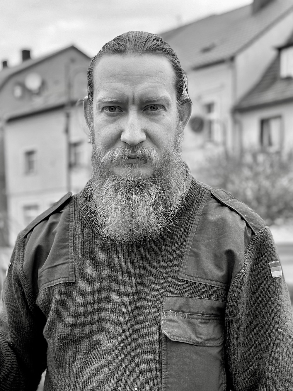 a man with a beard in Bundeswehr jumper